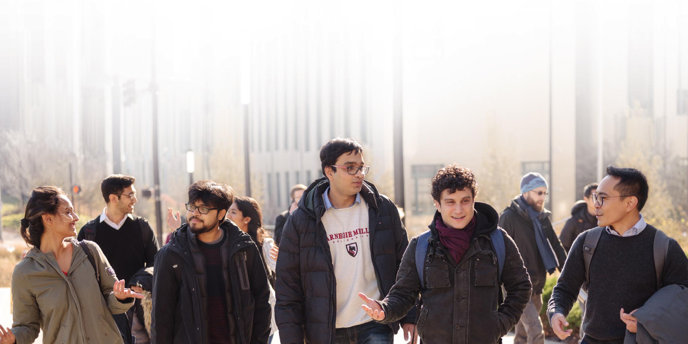 Group of students walking outside on campus